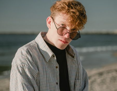 the-guy-looks-with-a-serious-look-with-glasses-in-a-plaid-shirt_t20_8XWKQV the-guy-looks-with-a-serious-look-with-glasses-in-a-plaid-shirt_t20_8XWKQV